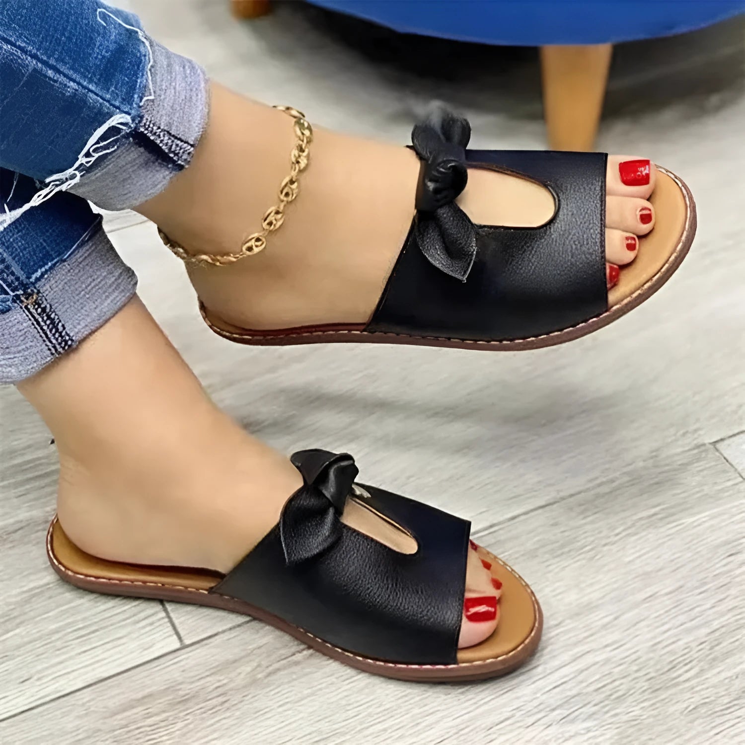 Ladies fish mouth sandals with decorative bow in black, gold, or pink on a rubber sole.