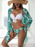 Women's three-piece polyester bikini swimsuit set with mesh split, showing top, pants, and coat.