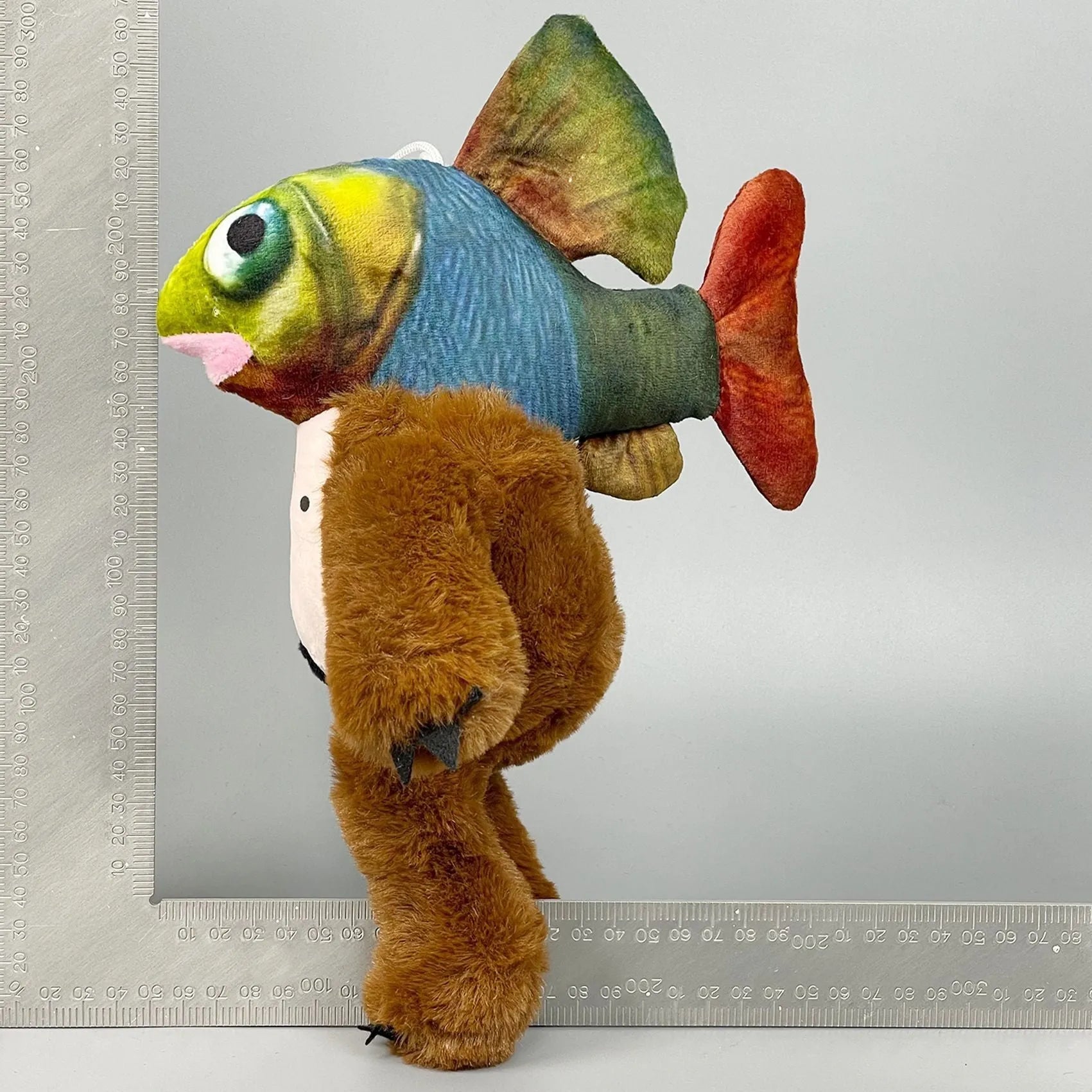 Shark game character plush toy collectible, such as cactus elephant or shark running shoes design, made from soft cotton wool.