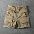 Men's straight-leg cotton cargo shorts with stretch in multiple colour options on a size chart.