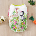 Colourful printed polyester t-shirt on a small dog, showing the casual fit and design.