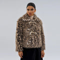 Women's leopard print coat with a buckle lapel fastener on a hanger.