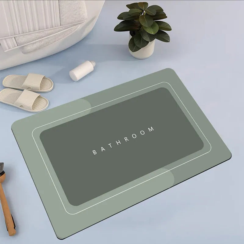 Diatom mud absorbent bathroom floor mat in blue rectangular shape on tiled floor