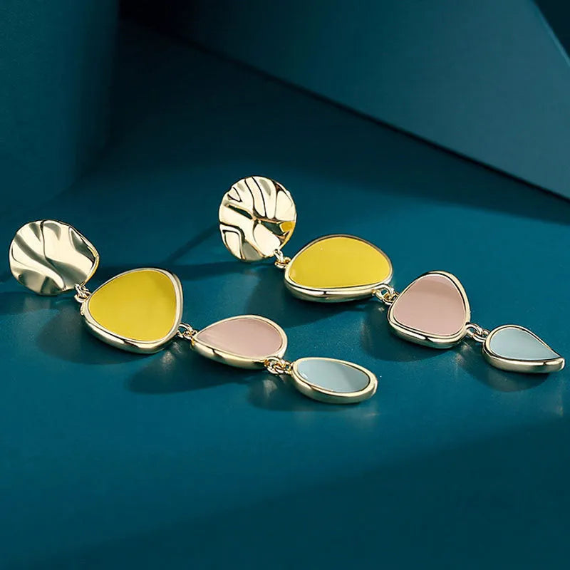 Morandi three-colour dripping oil finish alloy disc earrings on a sterling silver post.