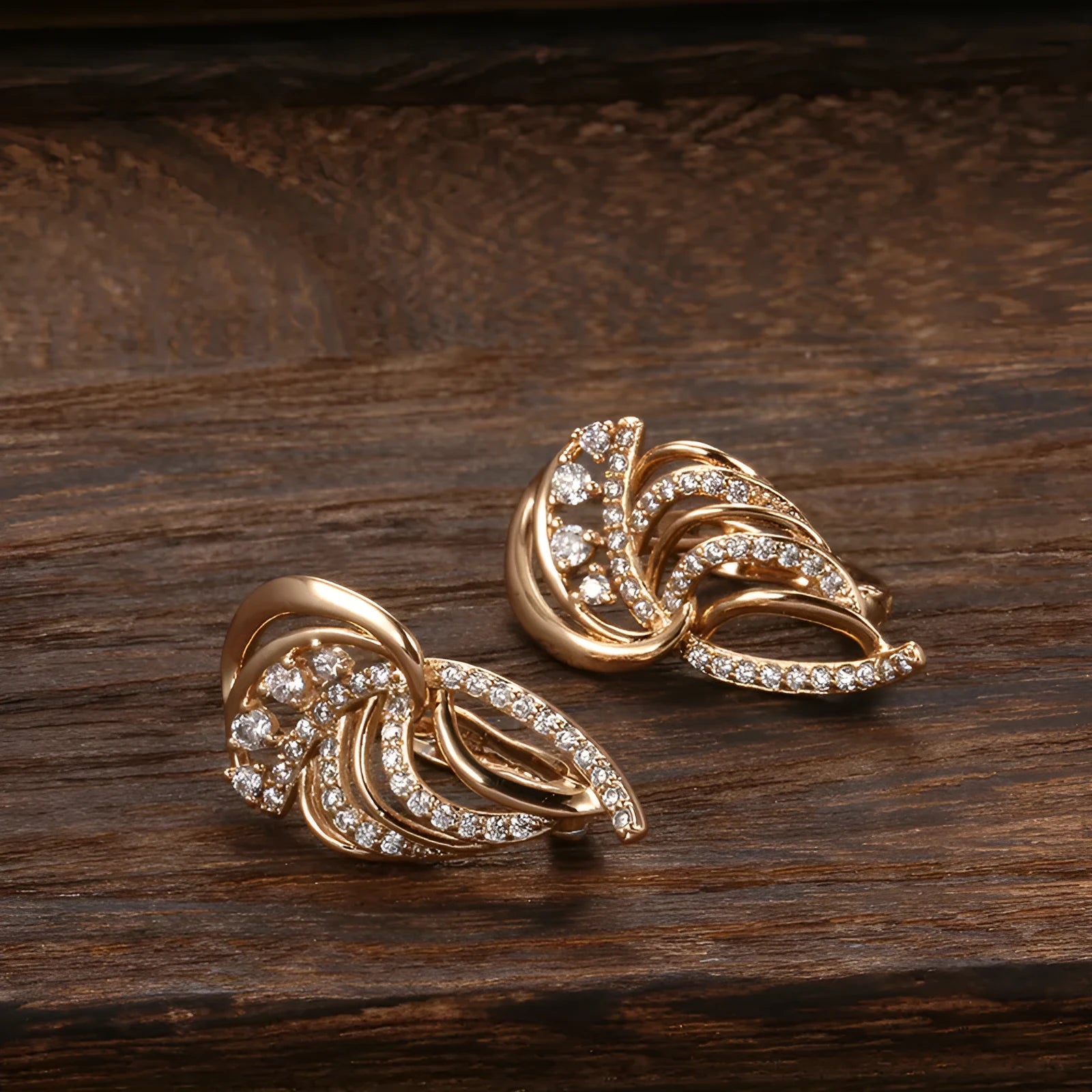 Wings design women's ear clips with micro inlaid zircon stones in gold-plated copper construction