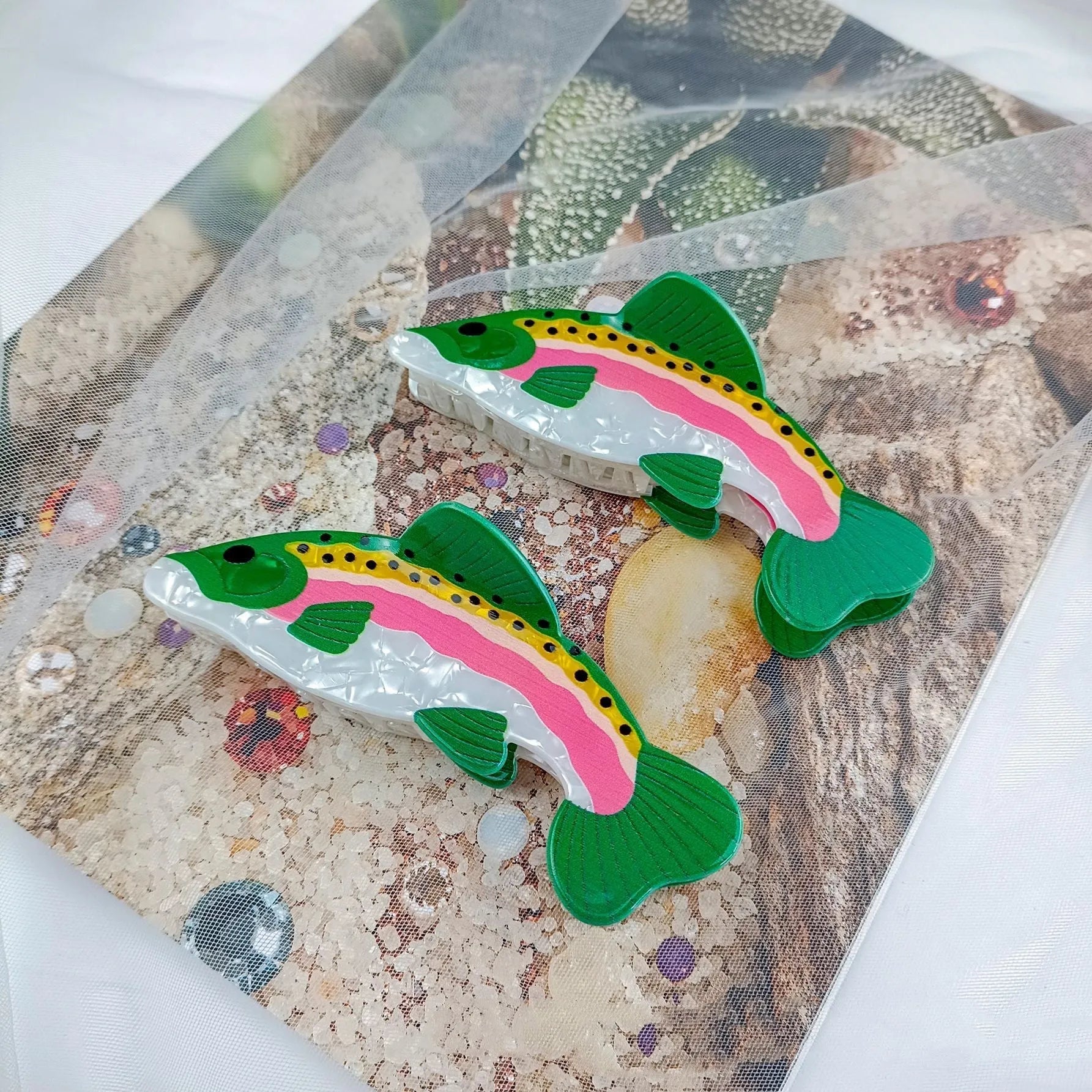 Dark green PVC hair clip with printed rainbow trout and carp design