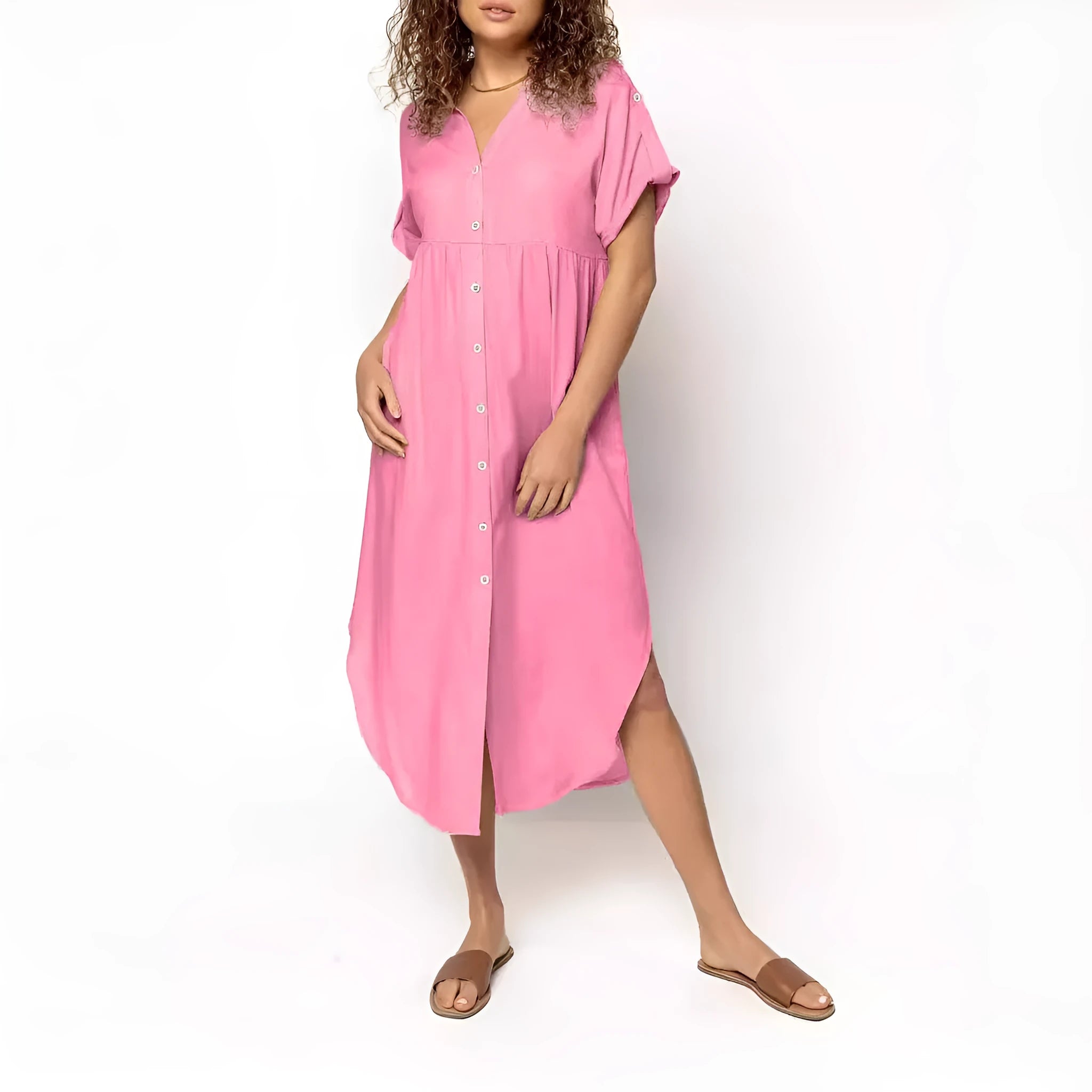 A woman wearing a loose-fitting, solid-colour midi dress with a button-down front and regular sleeves.