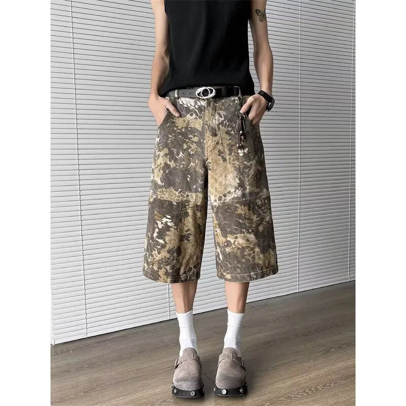 Yellow women's jeans with snake camouflage pattern and cropped leg length.