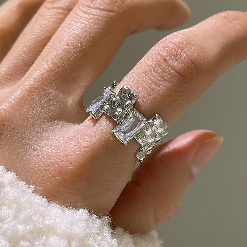 Silver geometric open ring with zircon stone setting and three-dimensional decoration