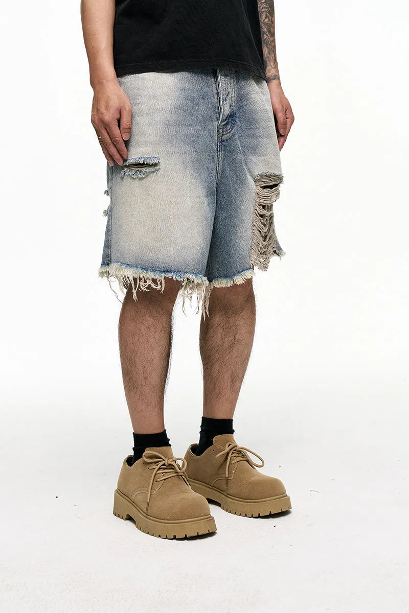 Men's light blue retro washed baggy denim shorts on a hanger