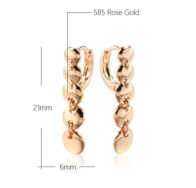 A pair of gold retro woven copper large circle hoop earrings.