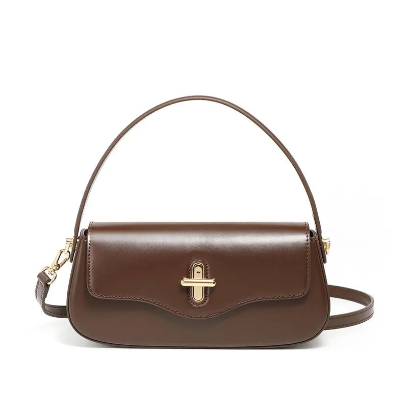 Genuine leather baguette handbag in caramel colour with clamshell design and shoulder straps