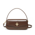 Genuine leather baguette handbag in caramel colour with clamshell design and shoulder straps