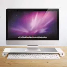 Aluminium and plastic computer monitor stand with four USB ports and hidden keyboard storage underneath