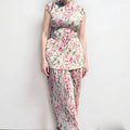 Women's printed chiffon dress set with high waist skirt and long sleeve top.