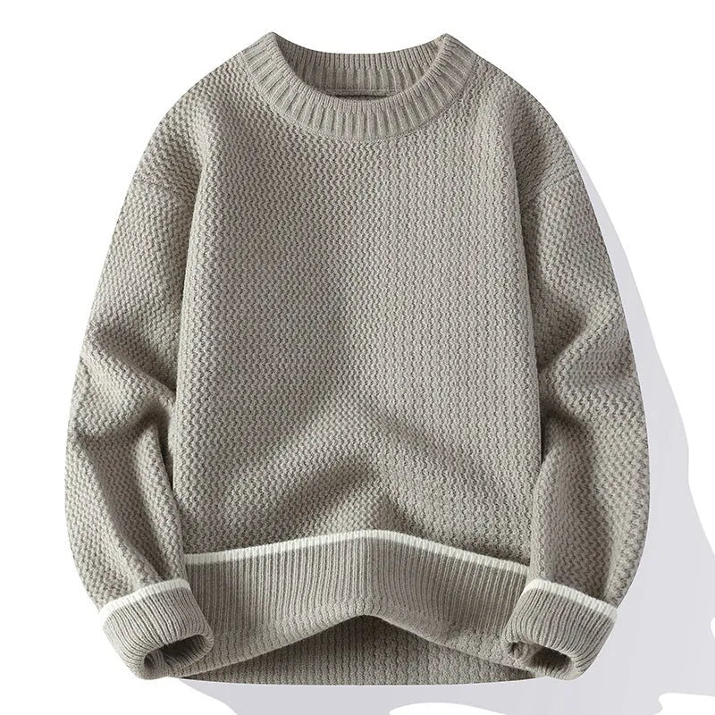 Grey loose fit men's round neck pullover sweater with long sleeves on a hanger.