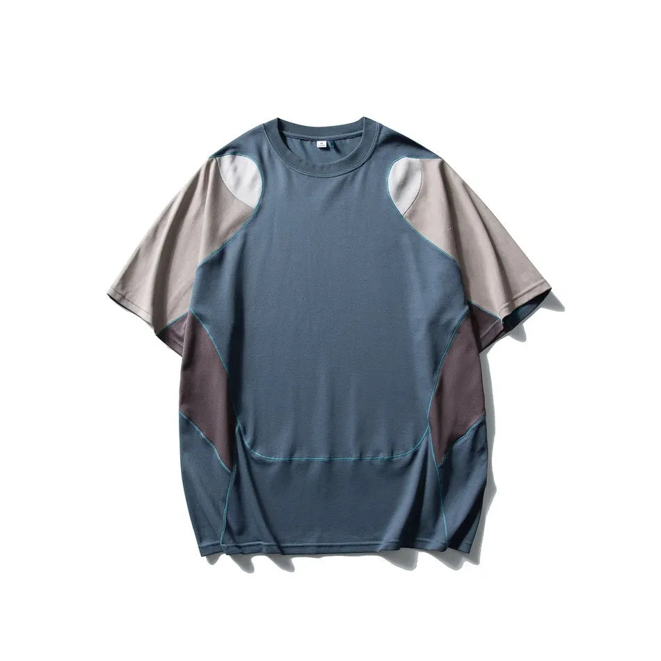 Men's loose blue t-shirt with patchwork contrast colour design and short raglan sleeves.
