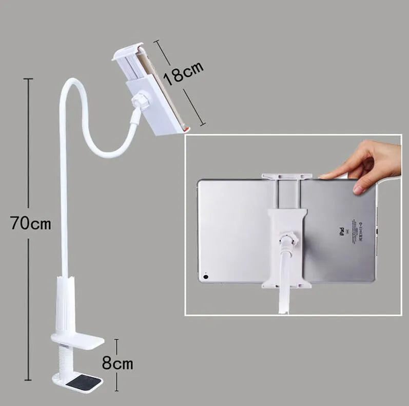 Black bedside oversize flat panel phone holder with long flexible arm mounted on a wooden table.