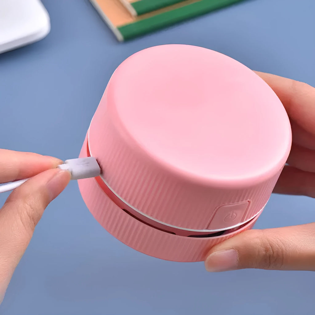 Mini desktop handheld vacuum cleaner in pink colour for pencil eraser chip cleaning