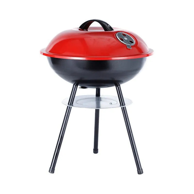 Portable 14-inch iron barbecue grill with Apple stove design on a patio.