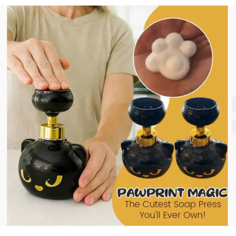 Black cartoon cat-shaped plastic foam soap dispenser measuring 10cm wide by 18cm tall