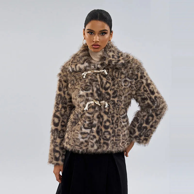 Women's leopard print coat with a buckle lapel fastener on a hanger.