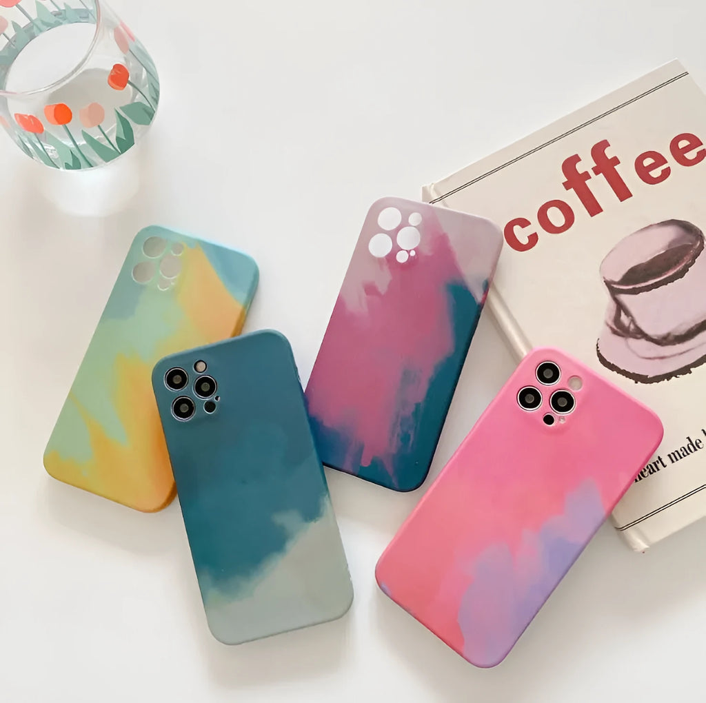 Soft silicone iPhone case with a blue and purple gradient geometric abstract pattern, shown on a phone.