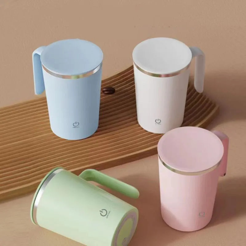 White automatic electric stirring cup with stainless steel finish and minimalist design on a table.