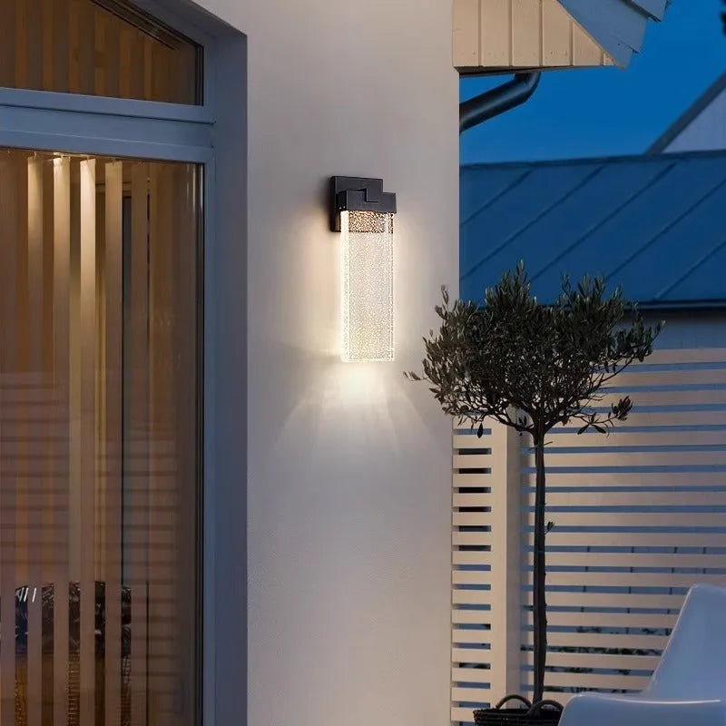 Black stainless steel outdoor LED wall lamp for courtyard and corridor mounting.