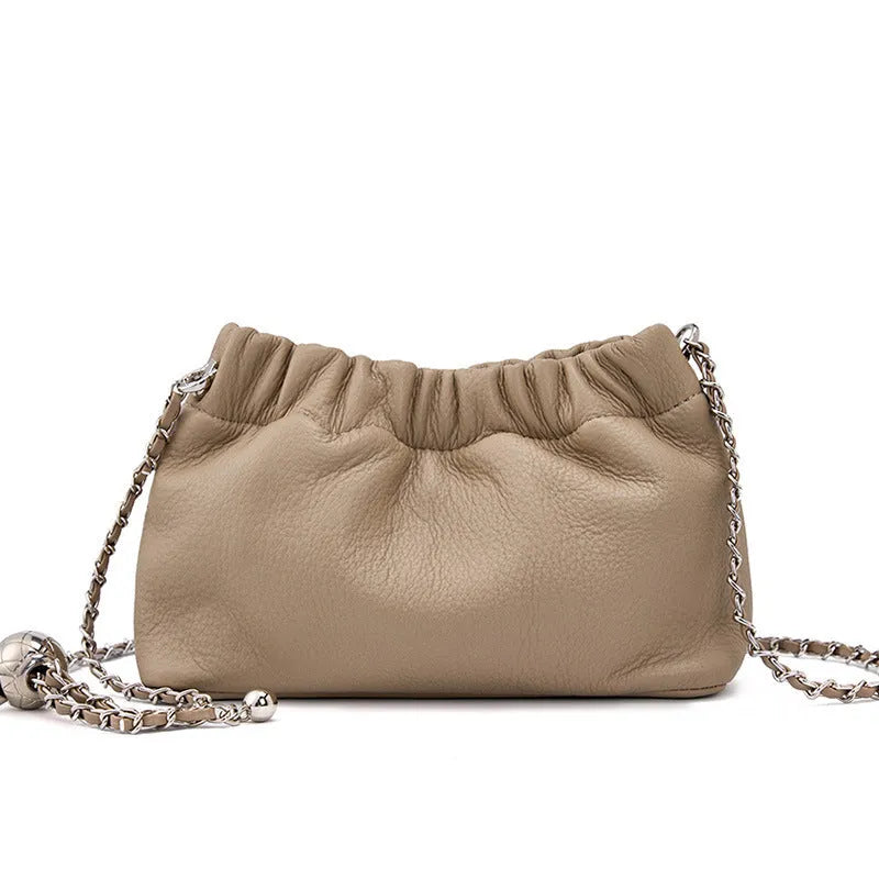 Women's soft genuine leather dumpling-shaped crossbody bag in grey with a chain shoulder strap.