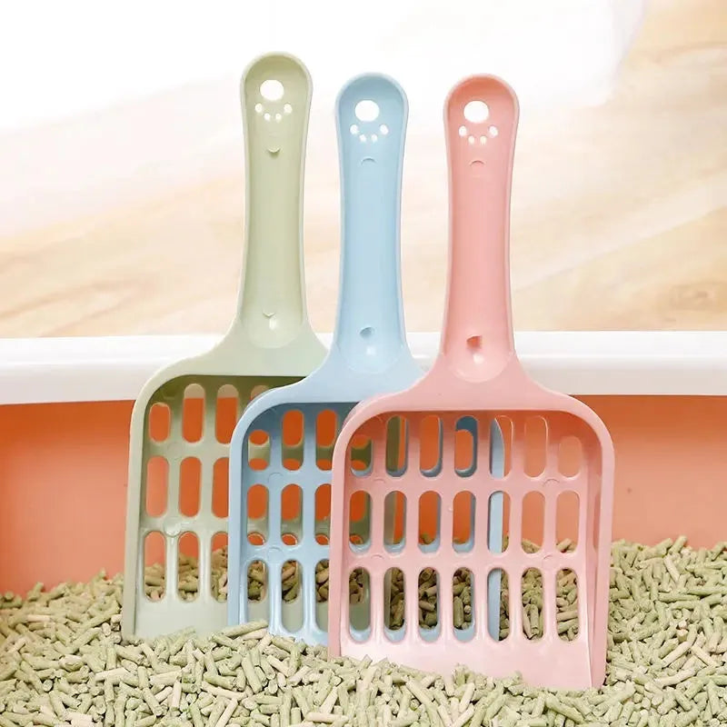 Blue plastic cat litter scoop, 20cm long, for cleaning litter trays.