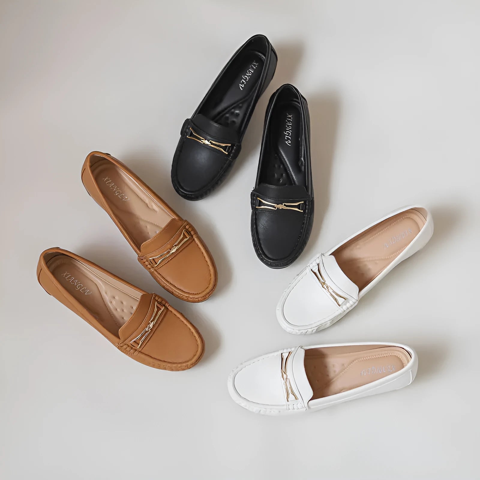 Men's black casual slip-on shoe with a built-in height increasing insole and a round toe design.