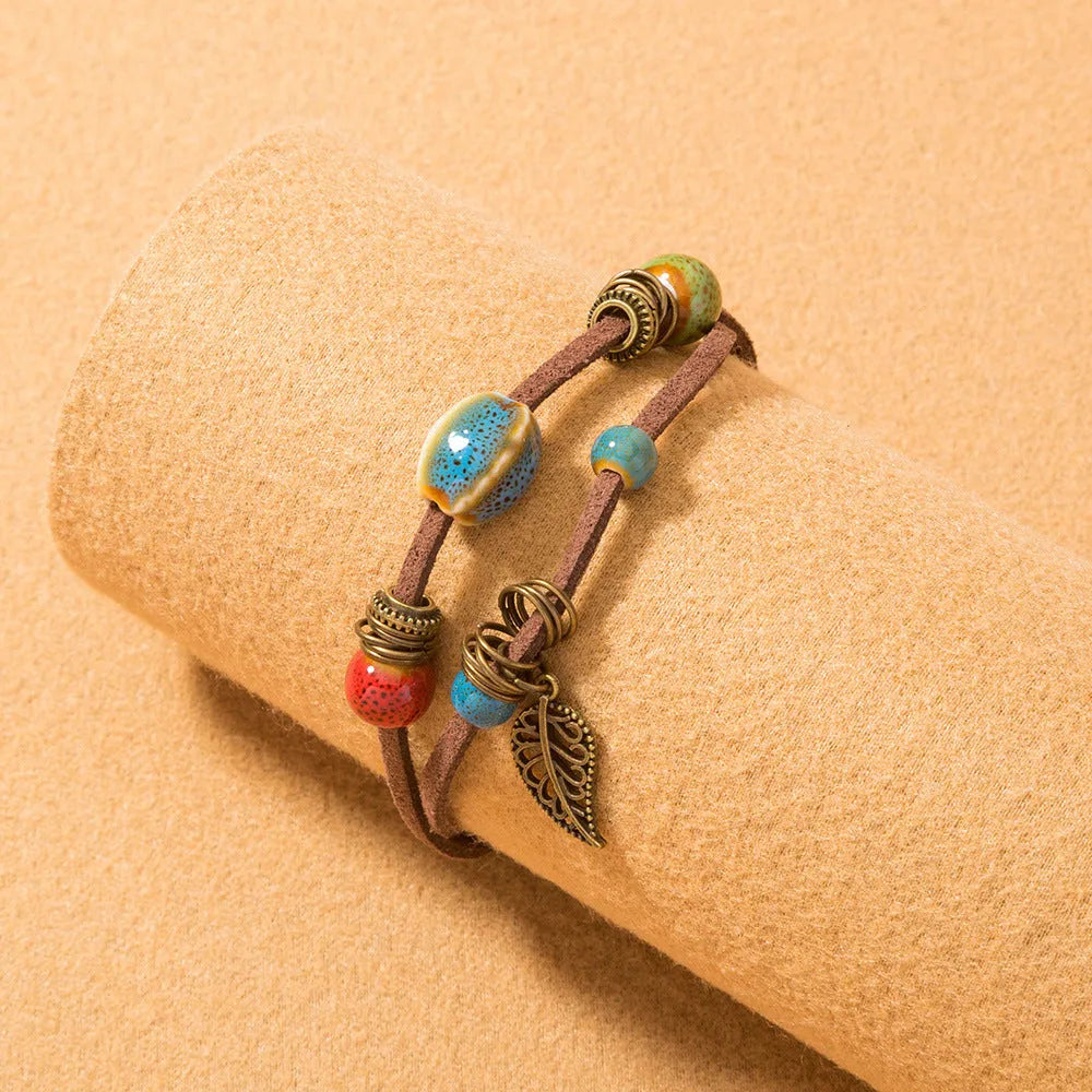 Hand-woven cowhide rope bracelet with blue ceramic beads geometric splicing style