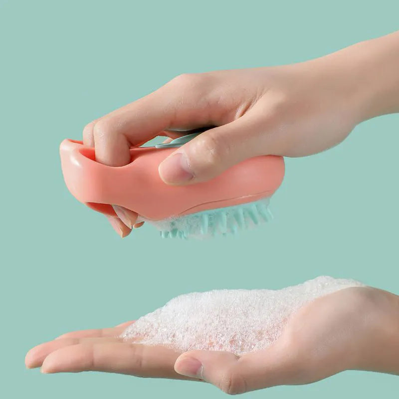 Blue silicone claw-shaped pet bath brush with flexible bristles for washing cats and dogs.