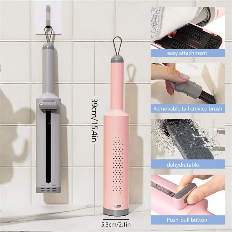 Pink rotatable self-squeeze flat mop with microfiber pad extended on a floor.