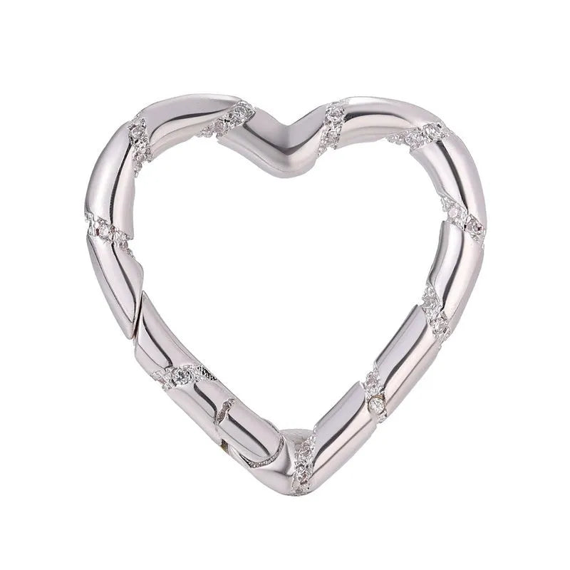 Copper climbing heart-shaped metal button with micro inlaid zircon stones, showing spring fastener and screw buckle style options.