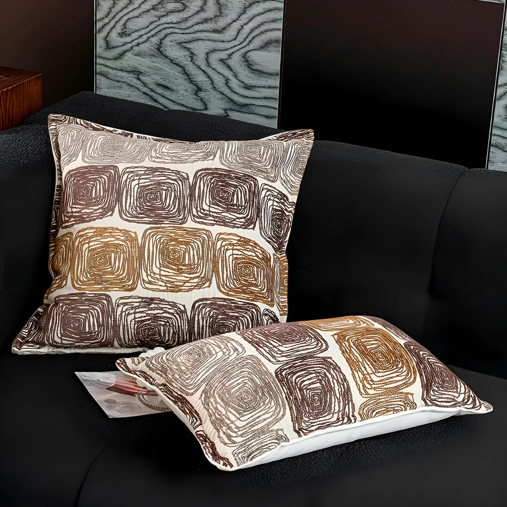 Cream and coffee-coloured abstract coil pattern on a 30x50cm square polyester pillow cover.