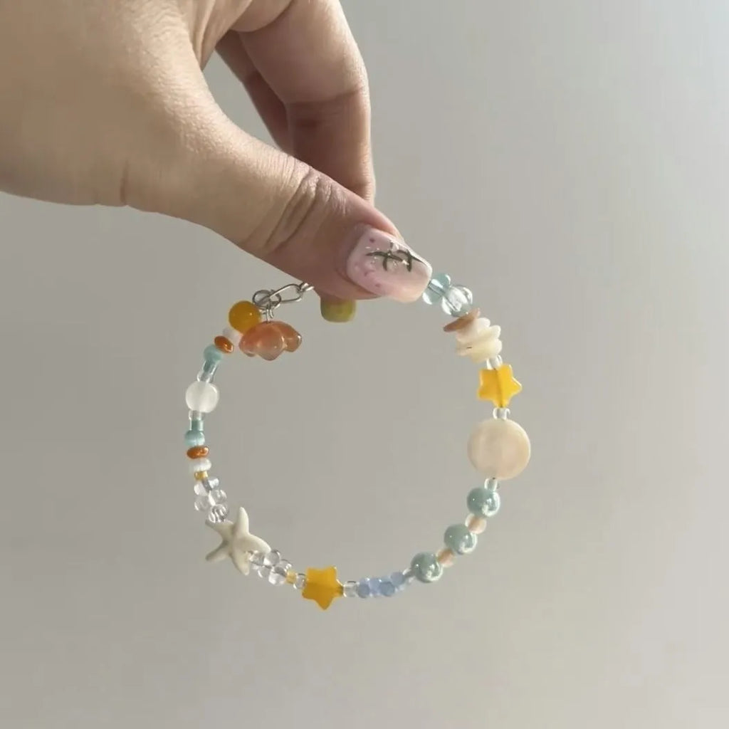 Mixed-material orange sea summer bracelet with diamond shape and round alloy elements