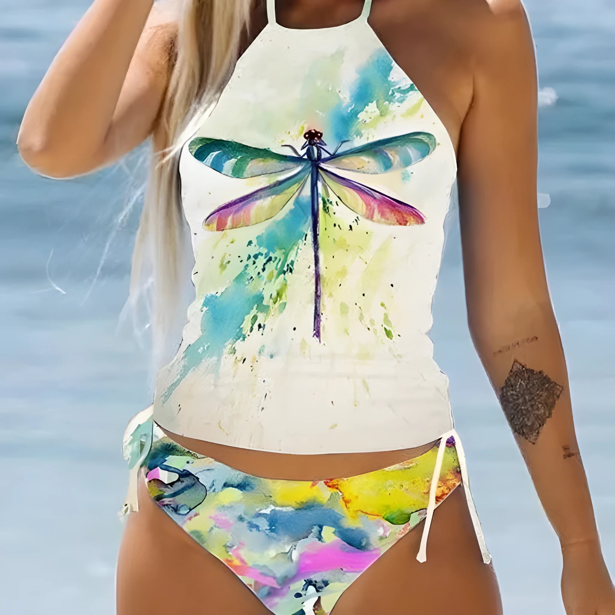 Conservative style women's swimsuit with colourful cartoon print and matching shorts.