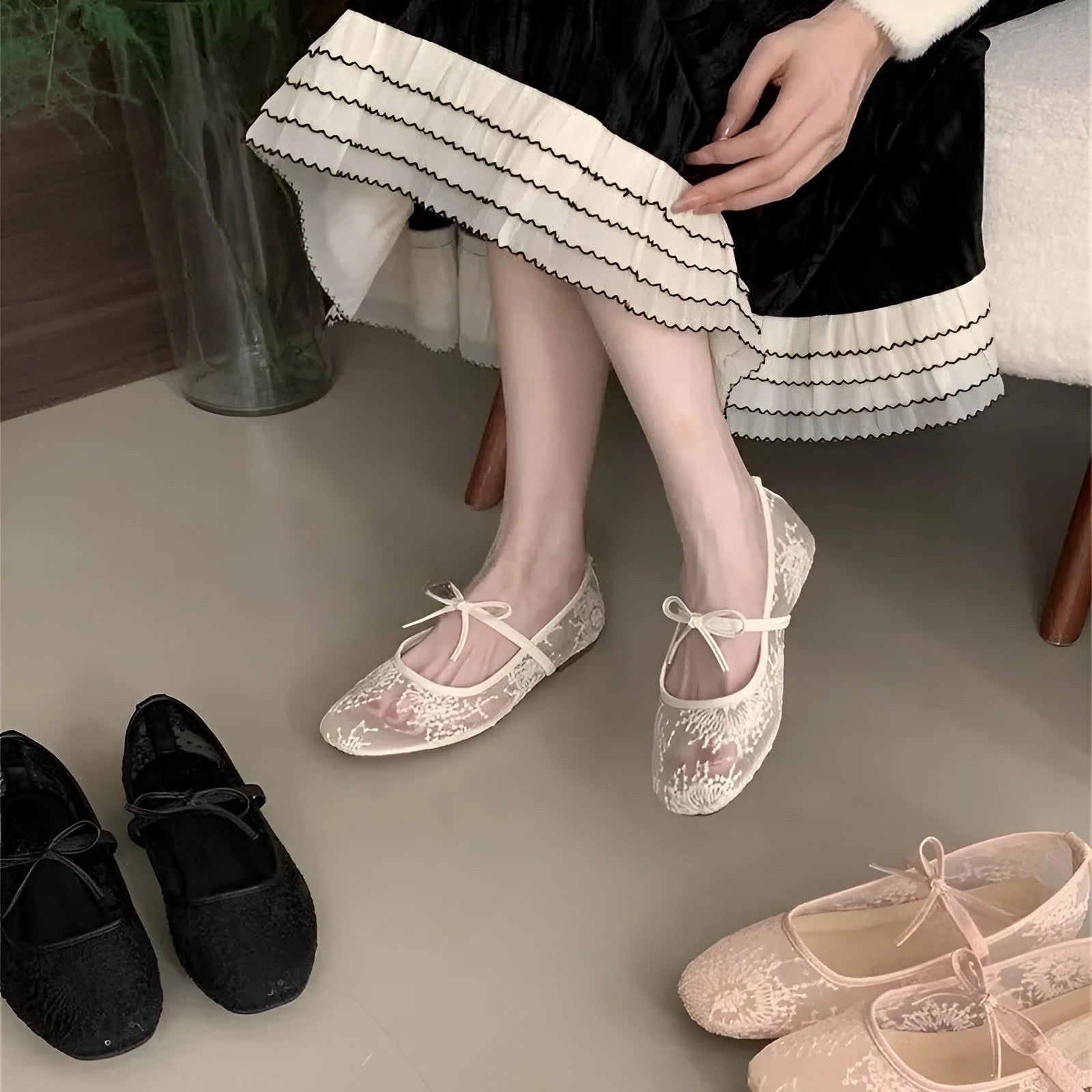 Women's pink flat lace mesh Mary Jane evening shoes with a mid heel on a white background.