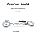 Silver zinc alloy metal handcuffs and footcuffs set for adult bondage play on a dark background.