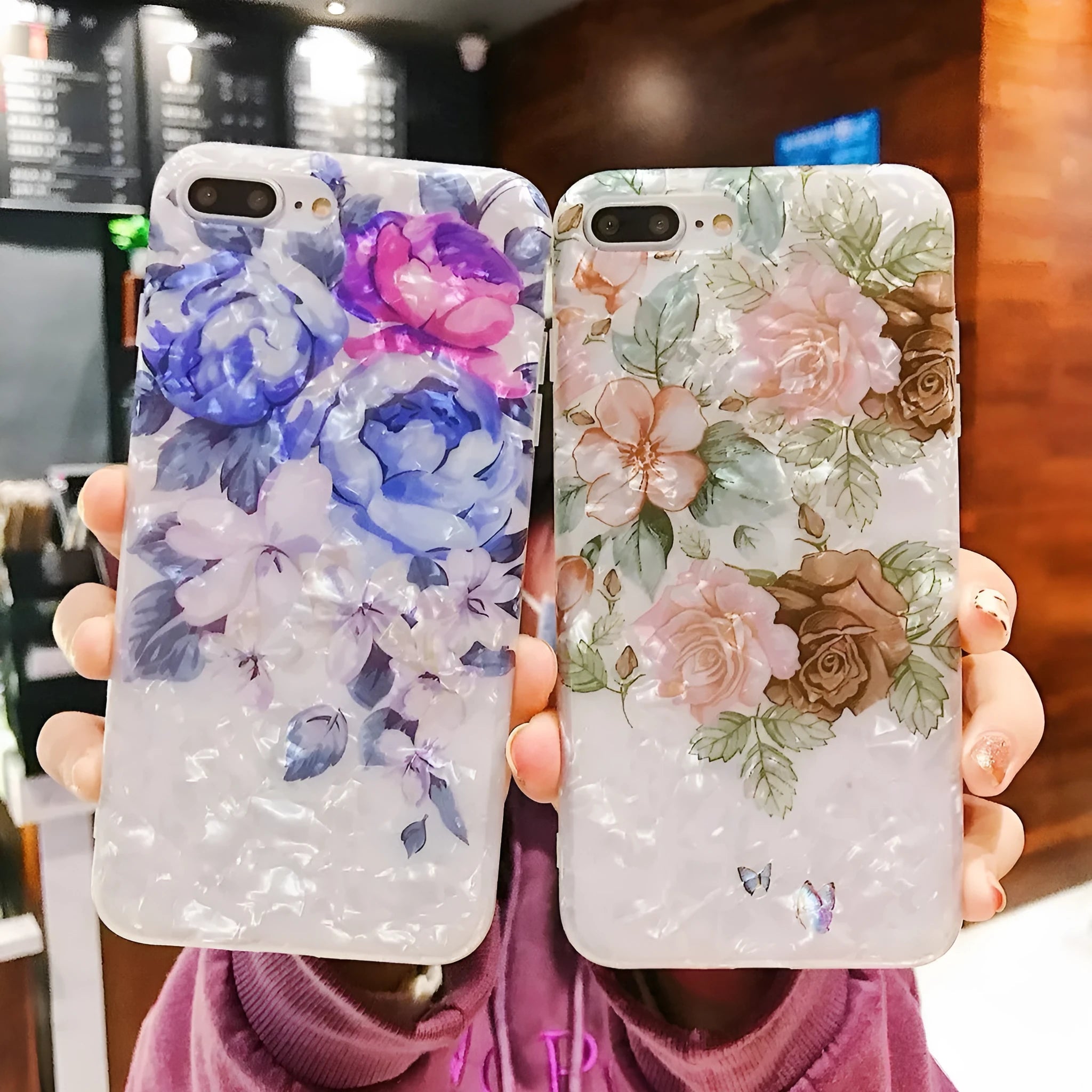 Dream Shell soft TPU iPhone case with rose flower design in brown, shown on an iPhone.