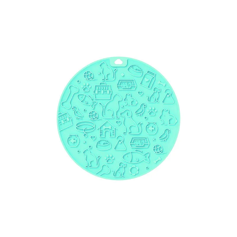 Round blue silicone pet licking mat with textured surface and a white suction cup base on the underside.