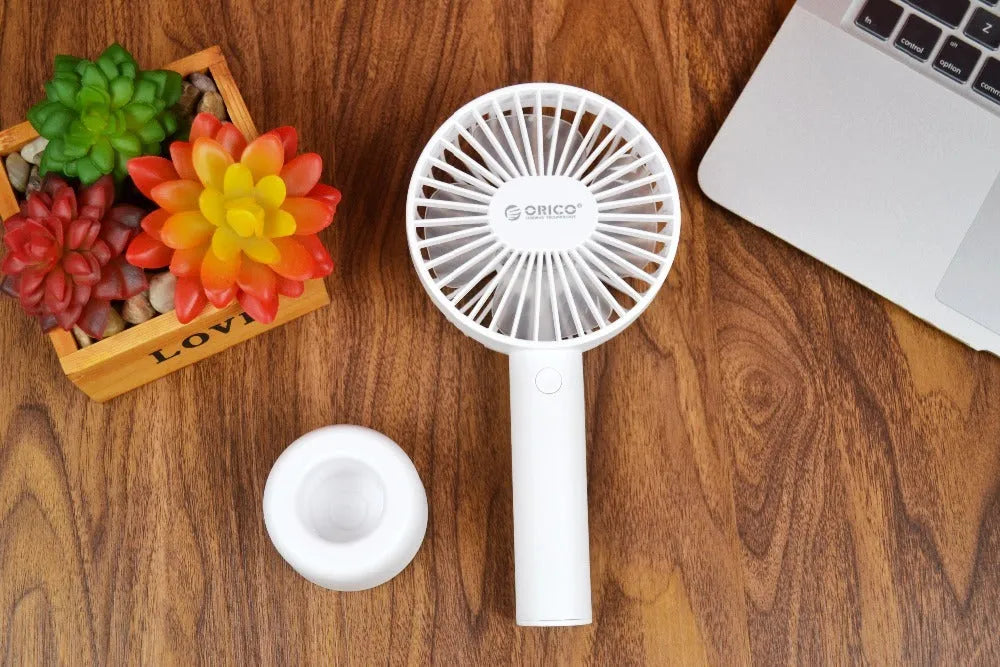 White ORICO FH1 rechargeable USB desktop and handheld fan showing fine line details on its ABS shell.