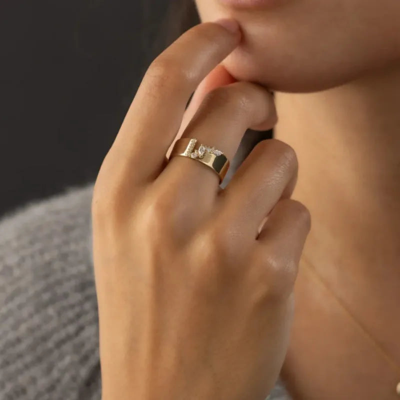 Gold electroplated copper women's ring with zircon stones showing UK size markings 6-10