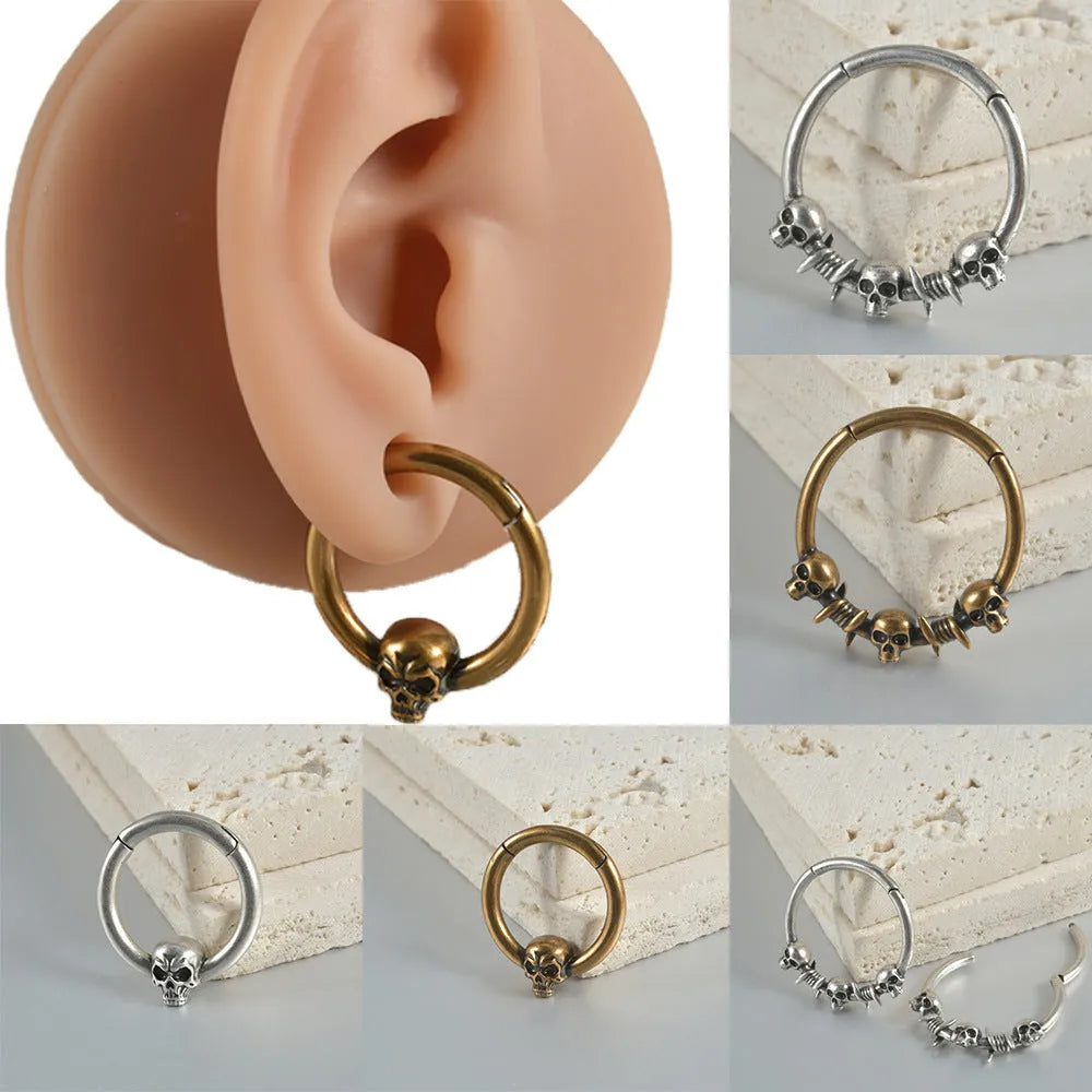 Copper punk earrings with ghost head design in antique gold or silver finish.