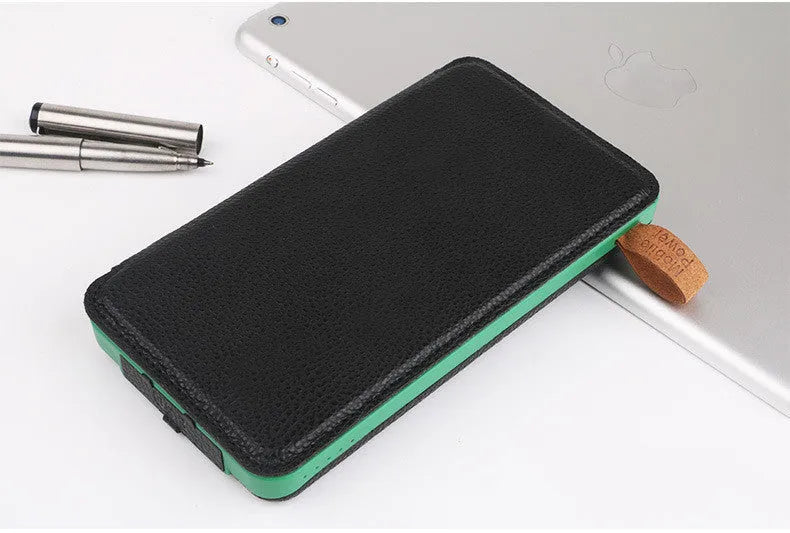 Black outdoor solar power bank with a solar panel, USB ports, and an LED light on a soft leather exterior.