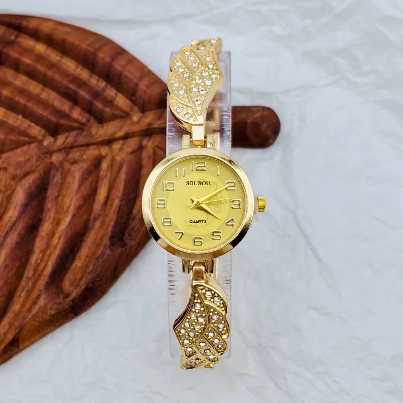 Stainless steel women's watch with round dial available in gold, white or black surface colours