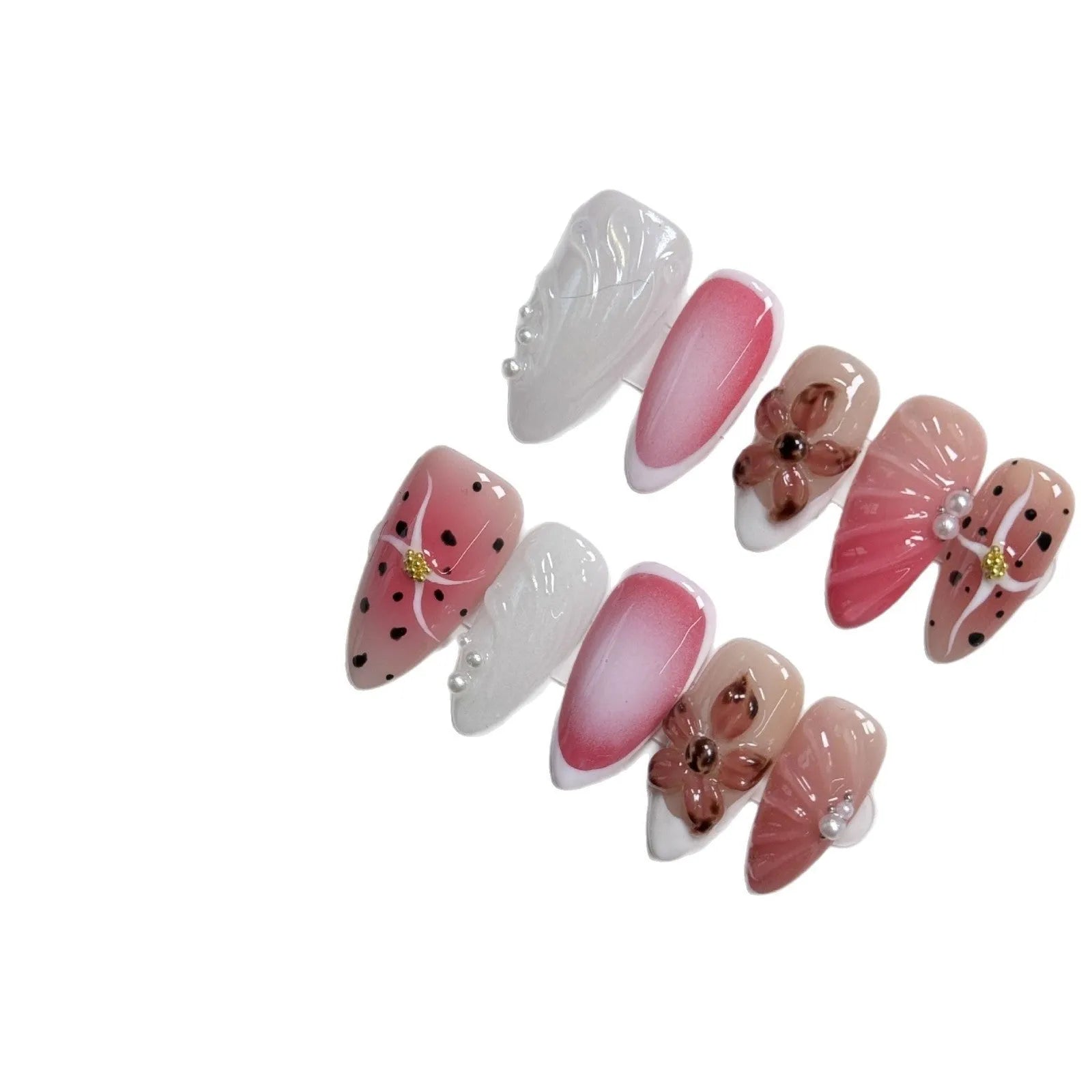 Set of hand-painted 3D carved nail beauty patches in embossed and candy patterns on a plastic sheet.
