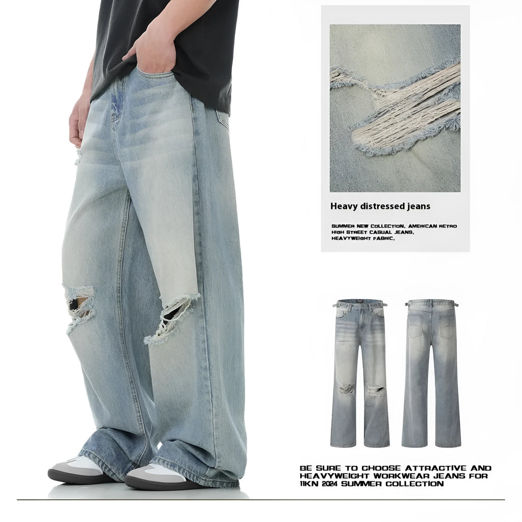 Blue straight-leg jeans with ripped detailing on cotton blend fabric